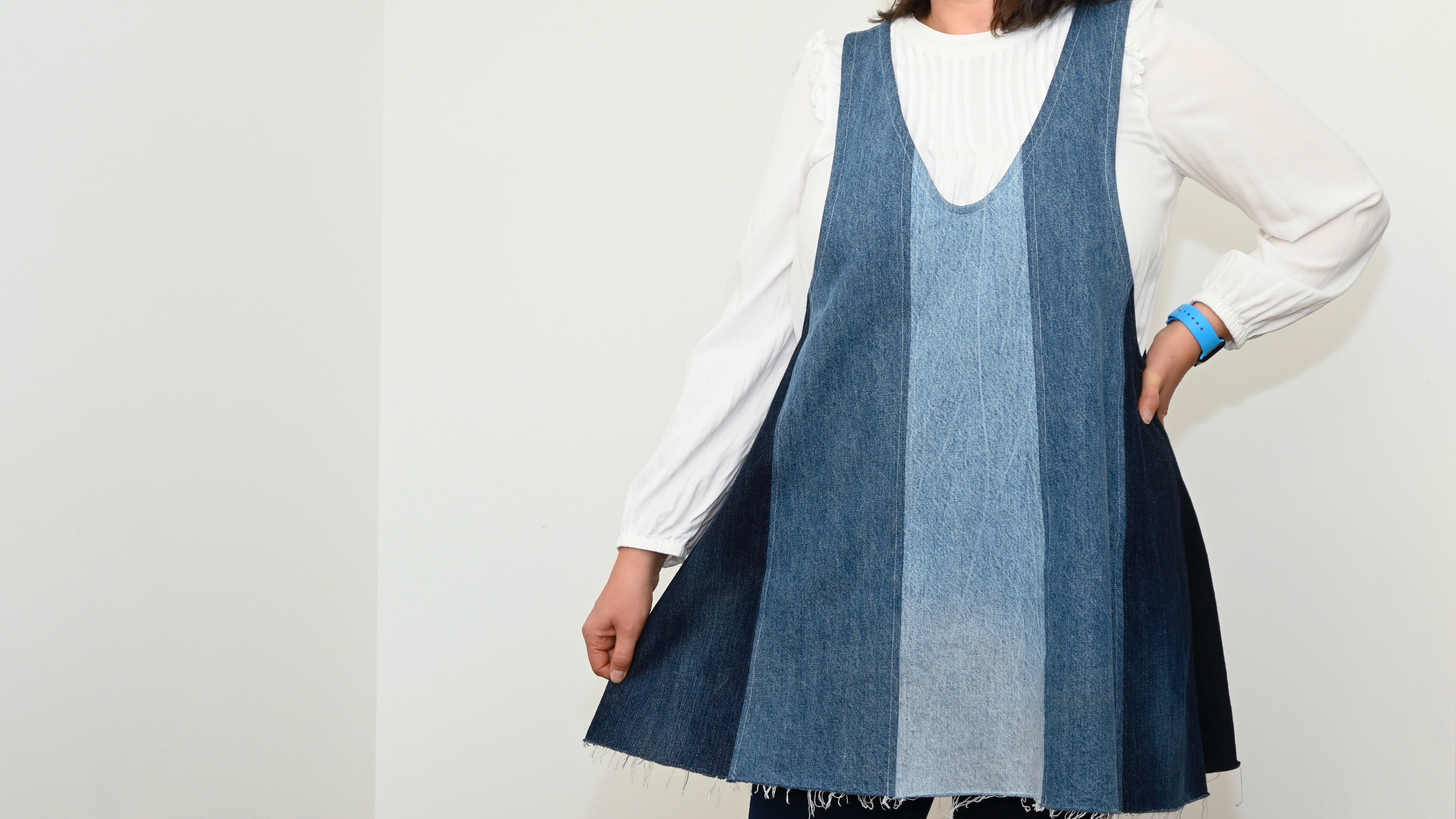 A female model wearing a Bluebell Dress with a black top